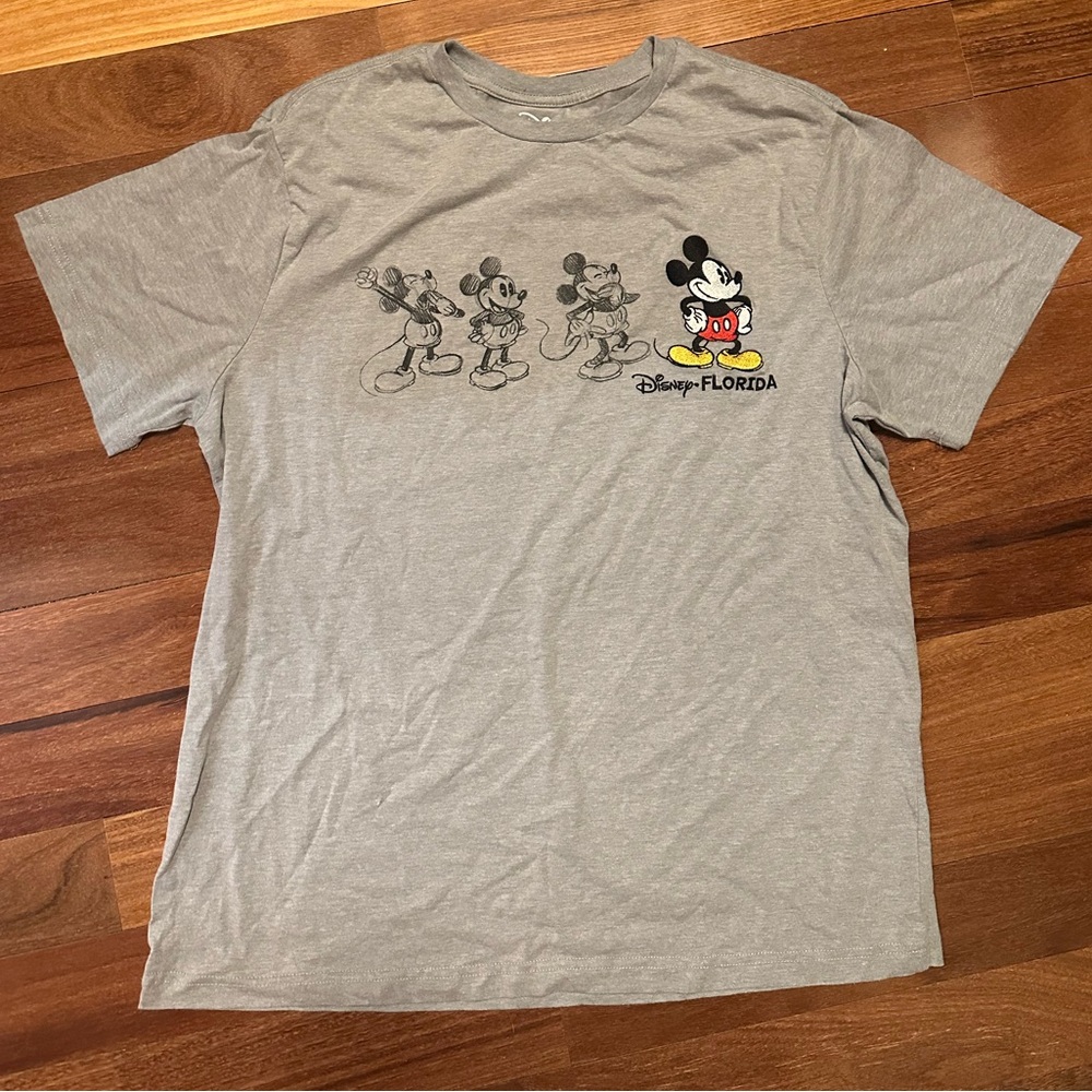 Disney Gray Mickey Evolution Graphic Tee with Red & Yellow Accents